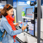 woman at self checkout line