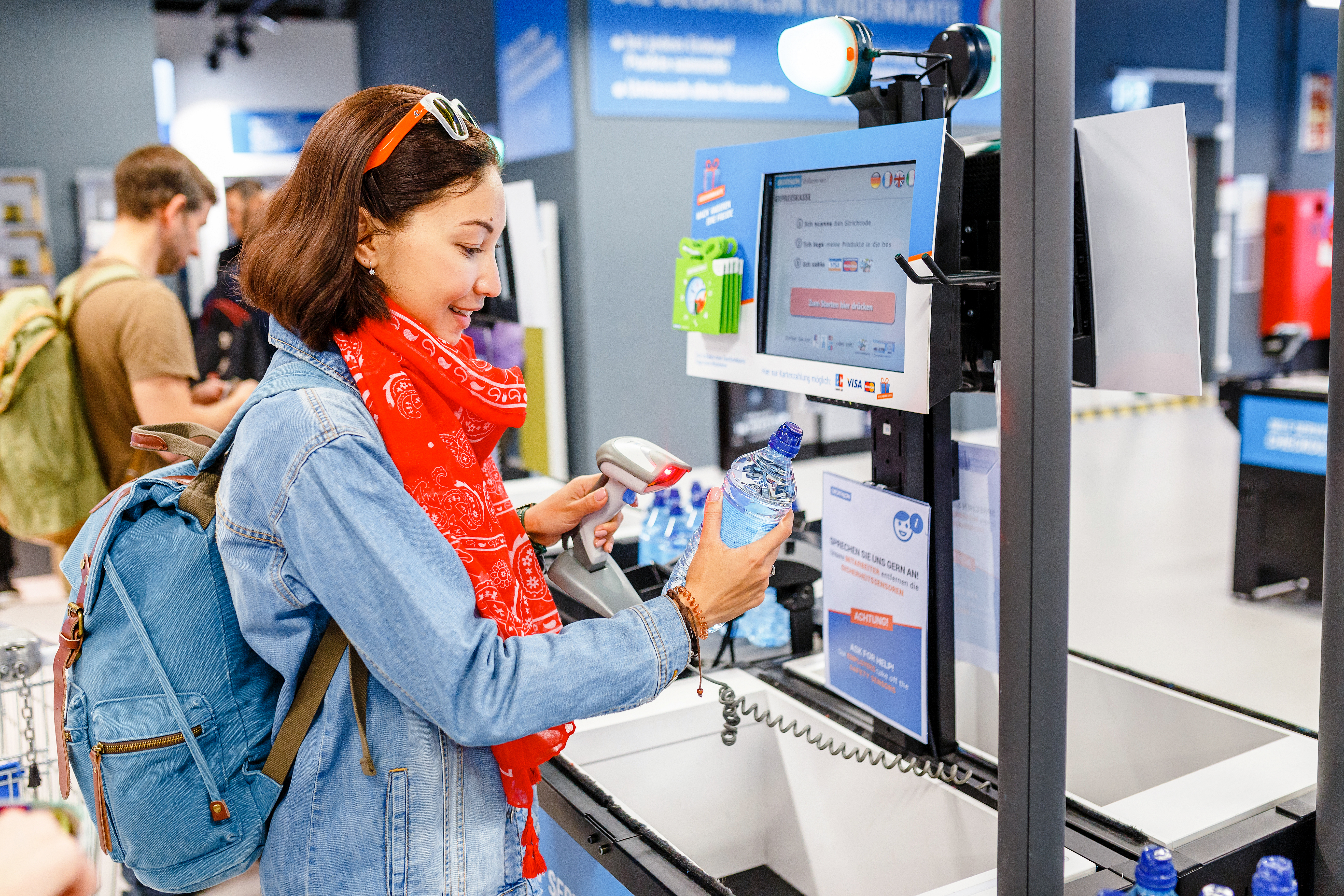 woman at self checkout line